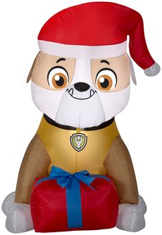 Deck the yard with an Airblown Inflatable Rubble from PAW Patrol! Accented with a Santa hat and present, this delightful Rubble inflatable makes an eye-catching addition to your outdoor Christmas decorations. Setup is super simple. Just plug it in, stake it down and watch the magic unfold. Display this whimsical holiday decoration as a standalone or combine it with other Airblown characters to create a custom scene. Includes everything needed for easy outdoor setup. Gemmy 3.22-ft Lighted Nickelodeon Gift Box Christmas Inflatable | G-110490 Blow Up Christmas Decorations, Large Christmas Decorations, Christmas Blow Up, Paw Patrol Christmas, Inflatable Christmas Decorations, Rubble Paw Patrol, Inflatable Decorations, Paw Patrol Nickelodeon, Present Christmas