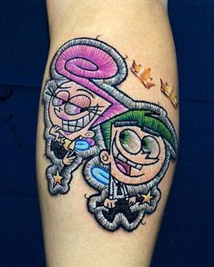 a cartoon character tattoo on the leg