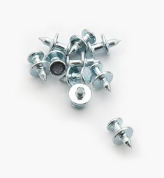 several screws and nuts on a white background