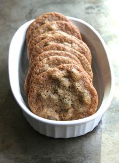 some cookies in a white bowl on a table