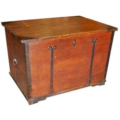 an old wooden chest with metal handles