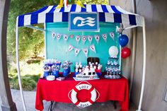 a party tent set up with cake and decorations