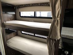 the bunk beds in this rv are made to look like they have no mattresses