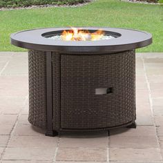 a fire pit sitting on top of a patio