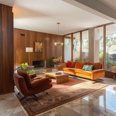 a living room filled with lots of furniture next to a large glass window covered wall