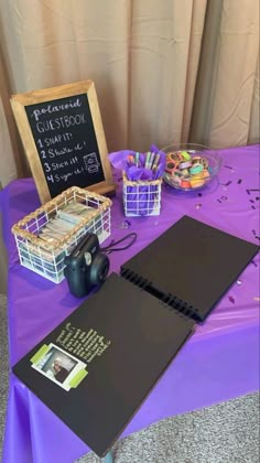 a purple table topped with lots of different items