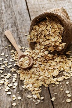 oats spilling out of a sack onto a wooden table