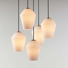 five light fixtures hanging from a ceiling fixture