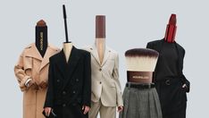 three mannequins with different types of clothes and makeup brushes in them, one is wearing a hat