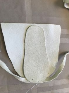 a white purse sitting on top of a table