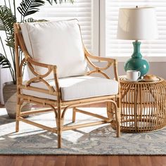 a wicker chair sitting on top of a wooden floor next to a green vase