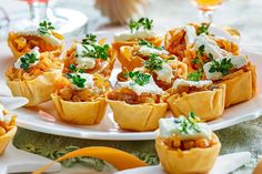 small appetizers are arranged on a white plate