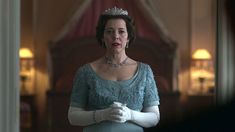 queen elizabeth in blue gown with tiara and gloves