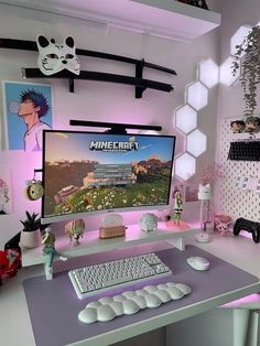 a desk with a computer, keyboard and mouse in front of a wall mounted minecraft poster