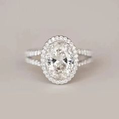 an oval cut diamond ring with double halos