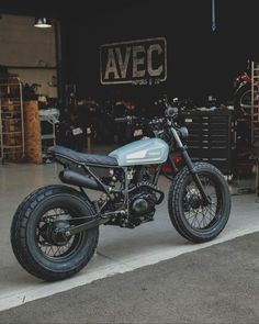 a motorcycle parked in front of a garage