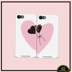 two phone cases with hearts and bows on them, one has a pink heart in the middle