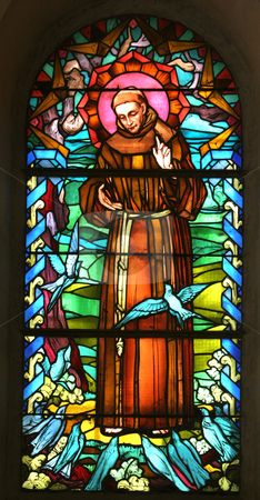 a stained glass window with a man holding a barrel