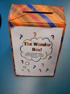 a paper box with question marks on it and the word'the wonder box '