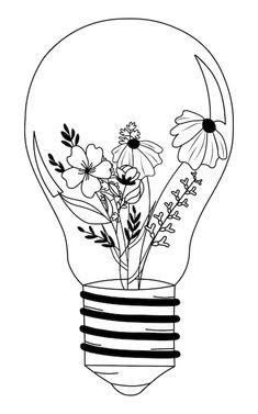 a light bulb with flowers in it and the inside is black and white, as well as