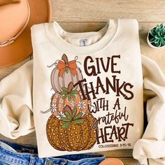 a t - shirt that says give thanks with a grateful heart and pumpkins on it