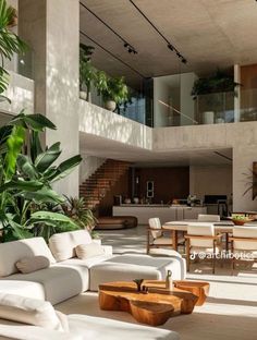 a living room filled with lots of white furniture