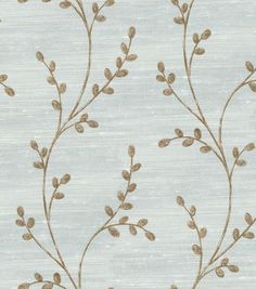 a blue and gold wallpaper with small leaves on the top of it, against a light blue background