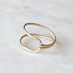 So unique, this hammered gold filled ring is perfect for every day.  I call it the "hug" ring...each is handmade and varies slightly.  You can wear it with two bands facing up or with the squeezed side up. ;) Please choose from sizes 4-11 using the dropdown box.  Can also make in sterling! Looks great layered with the stacked gems rings...just slip inside the widest part of ring.                    ==You can view the whole ring collection== http://www.etsy.com/shop/BellatrinaJewelry?section_id=1 Gold Minimalist Adjustable Bypass Ring, Everyday Hammered Open Midi Rings, 14k Gold Filled Open Stackable Rings, Gems Rings, Gold Dainty Ring, Hug Ring, Gold Wrap Ring, Rings Etsy, Wrap Ring