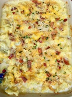 a casserole dish filled with eggs and bacon