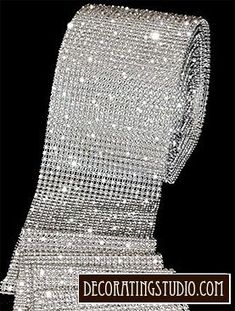 a close up of a tie with lots of diamonds on it's back side