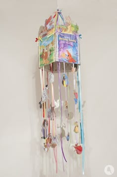 a wind chime hanging from the side of a wall in a child's room