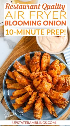 a plate full of chicken wings with dipping sauce on top and the words restaurant quality air fryer blooming onion 10 - minute prep