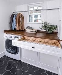 a washer and dryer sitting on top of a counter