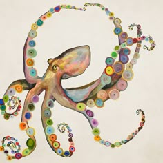 an octopus made out of buttons on a white background with multicolored circles around it