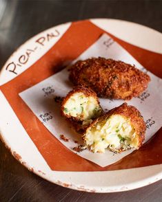 three crab cakes on a plate with the word readup written on it