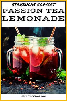 two mason jars filled with lemonade and garnished with mint leaves