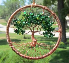 a wire tree ornament with green beads