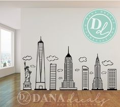 a wall decal with the statue of liberty in new york city, on top of a hard wood floor