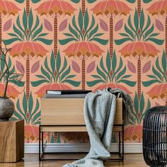 a living room with an orange and green wallpaper, a black birdcage on the floor