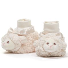 These adorable Lamby lamb booties are complete with lamb's head and embroidered eyes to ensure safe use for all ages. Lamby booties are adorned with a satin ribbon trim and bow of paisley design. A cushioned foot bed creates a snug comfortable fit for keeping little feet cozy and warm. Traction dots are placed throughout each sole to ensure that Lamby booties are slip proof. Lamby lamb booties are from the Bearington Collection of designer quality baby gifts and accessories made with superior ma Harry Potter Games, Embroidered Eyes, Animal Slippers, Disney Figurines, Soft Stuffed Animals, Sock Animals, Vintage Plush, Baby Slippers, Unique Collectibles