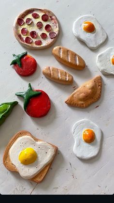 an assortment of food made to look like eggs, bread and vegetables