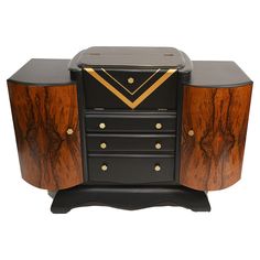 a black and brown cabinet with gold accents