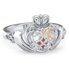 A symbol of loyalty, friendship, and love, this Claddagh design features a Celtic-inspired caged heart. The three-dimensional cage holds 2 or 3 loose heart-shaped birthstones sealed inside to represent your loved ones. Design yours in sterling silver, white, yellow, or rose gold with a choice of gemstones and personalize with a unique ring base engraving for the perfect gift for someone special. Celtic Claddagh Ring, Ring With Gemstone, Knot Rings, Silver Claddagh Ring, Mothers Ring, Claddagh Ring, Celtic Knot Ring, Claddagh Rings, Celtic Rings