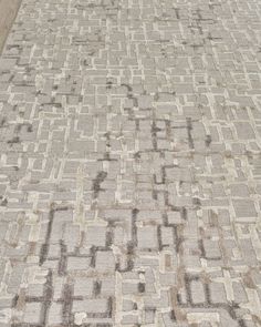 an area rug that is made up of squares and rectangles in various colors