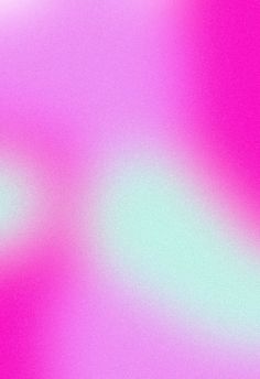 a blurry image of pink and green colors