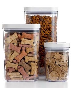 three plastic containers filled with different types of dog treats