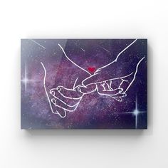 two hands holding each other with the word love written on it in front of a galaxy background