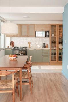 the kitchen is clean and ready to be used as a dining room or living room