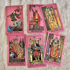 four pink tarot cards with images of people on them