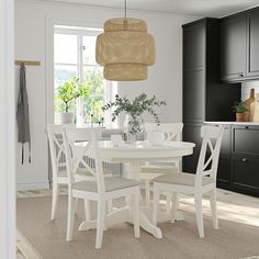 a white table and chairs in a room